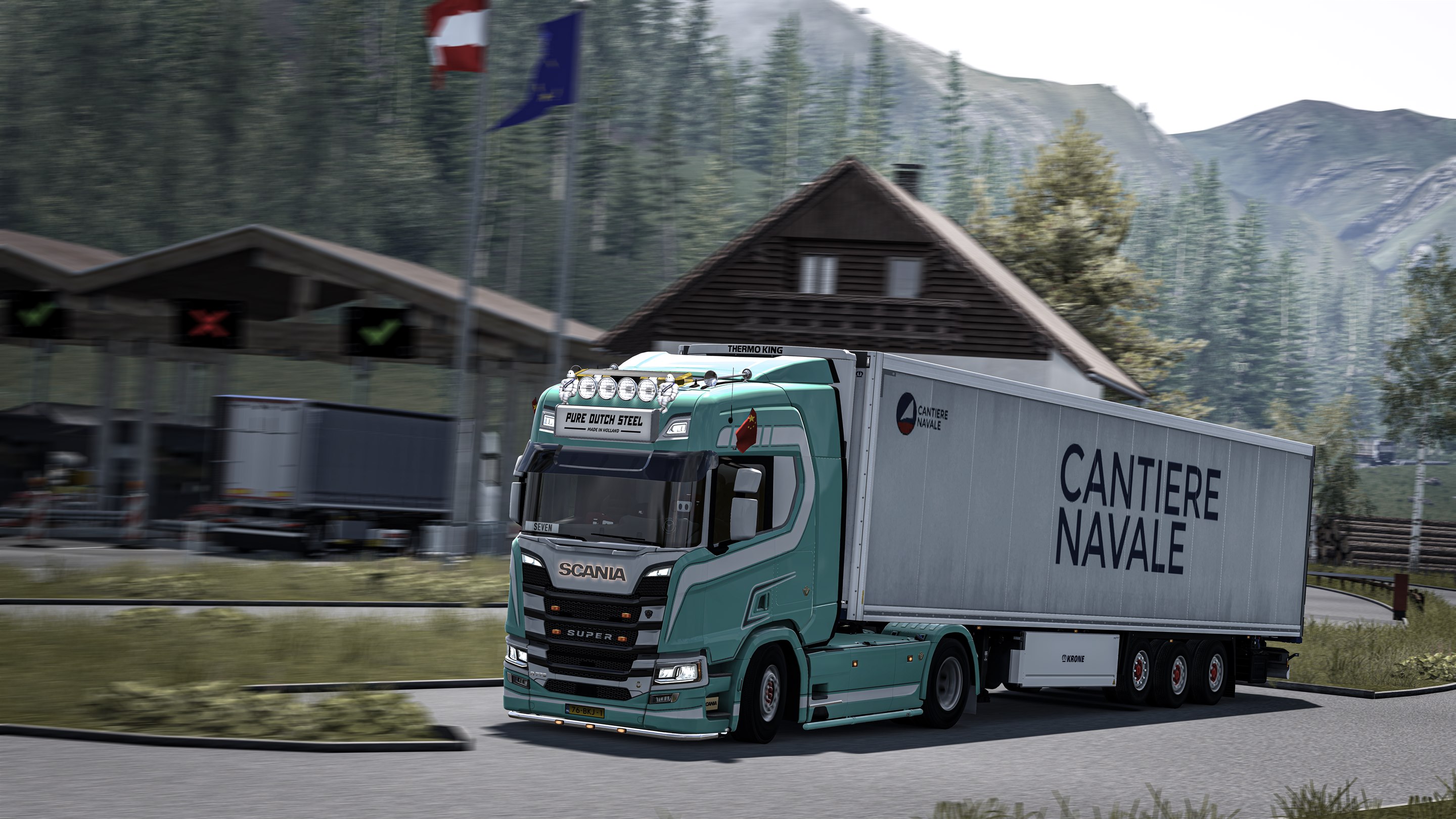 Seven 驾驶青绿色 Scania 卡车驶过山间公路